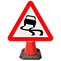 Slippery Road Surface Ahead - 557  safety sign