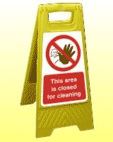 Closed for cleaning freestanding sign This area is closed for cleaning