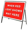 When red light shows wait here  safety sign